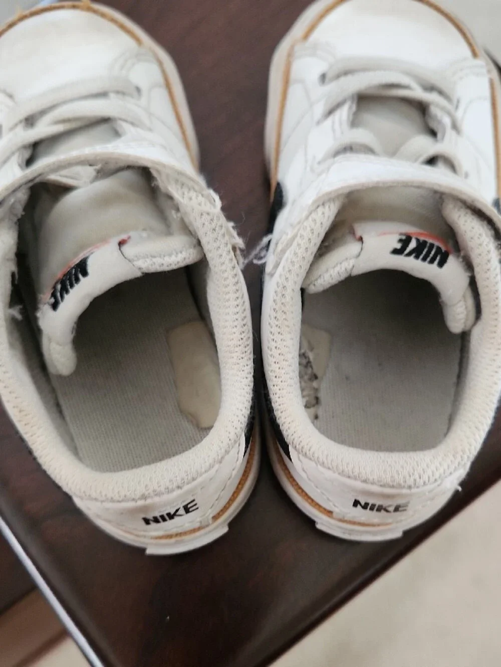 Nike Toddler White Sneakers with Black Swoosh and Tan Trim